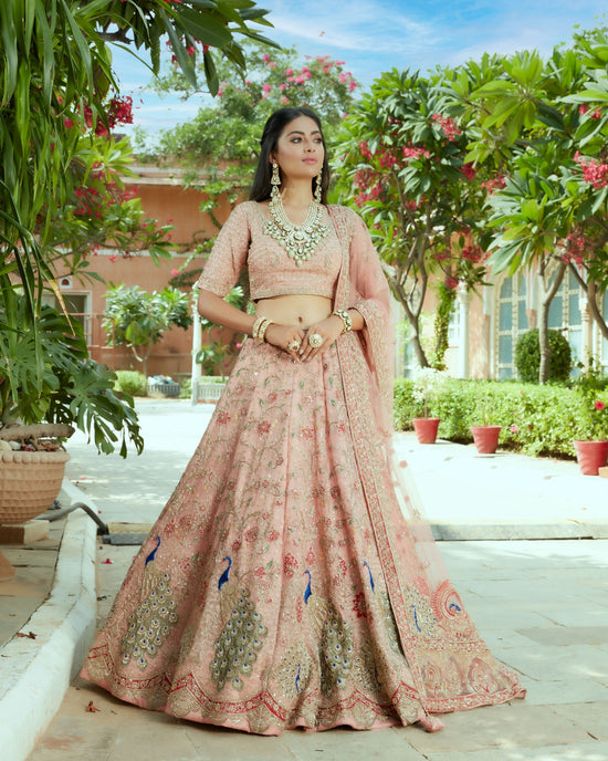 Rose Gold Organza Silk Heavily Embellished Lehenga Set In Floral And Peacock Jaal Work