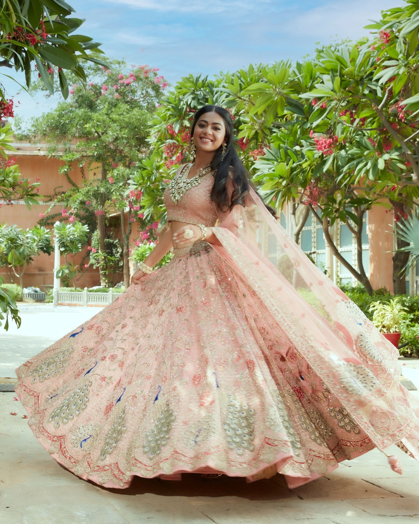 Rose Gold Organza Silk Heavily Embellished Lehenga Set In Floral And Peacock Jaal Work