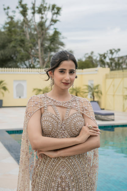 Beige Embellished Gown With Attached Cape