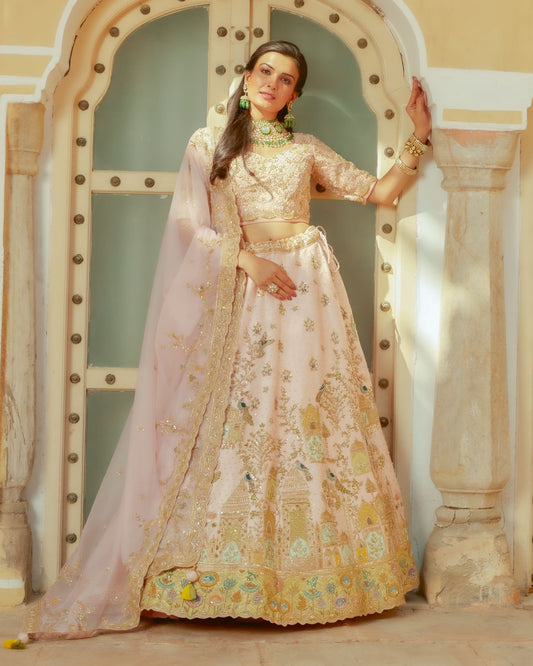 Pastel Pink Raw Silk Lehenga Having Royal Heritage Motifs In Zardozi Work With Choli And Dupatta